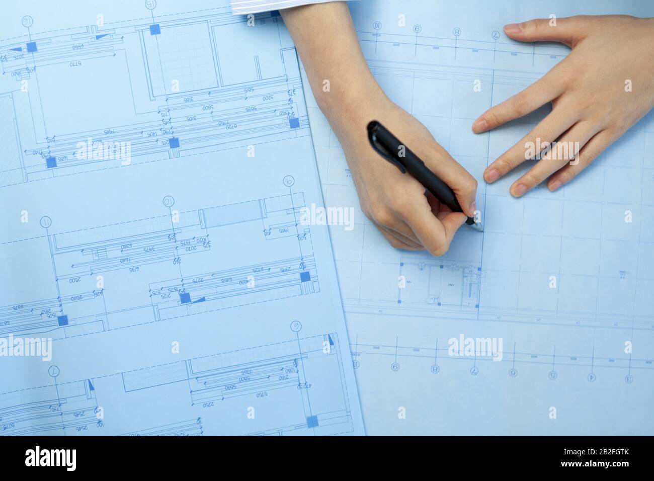 Architect drawing blueprints Beijing China Stock Photo