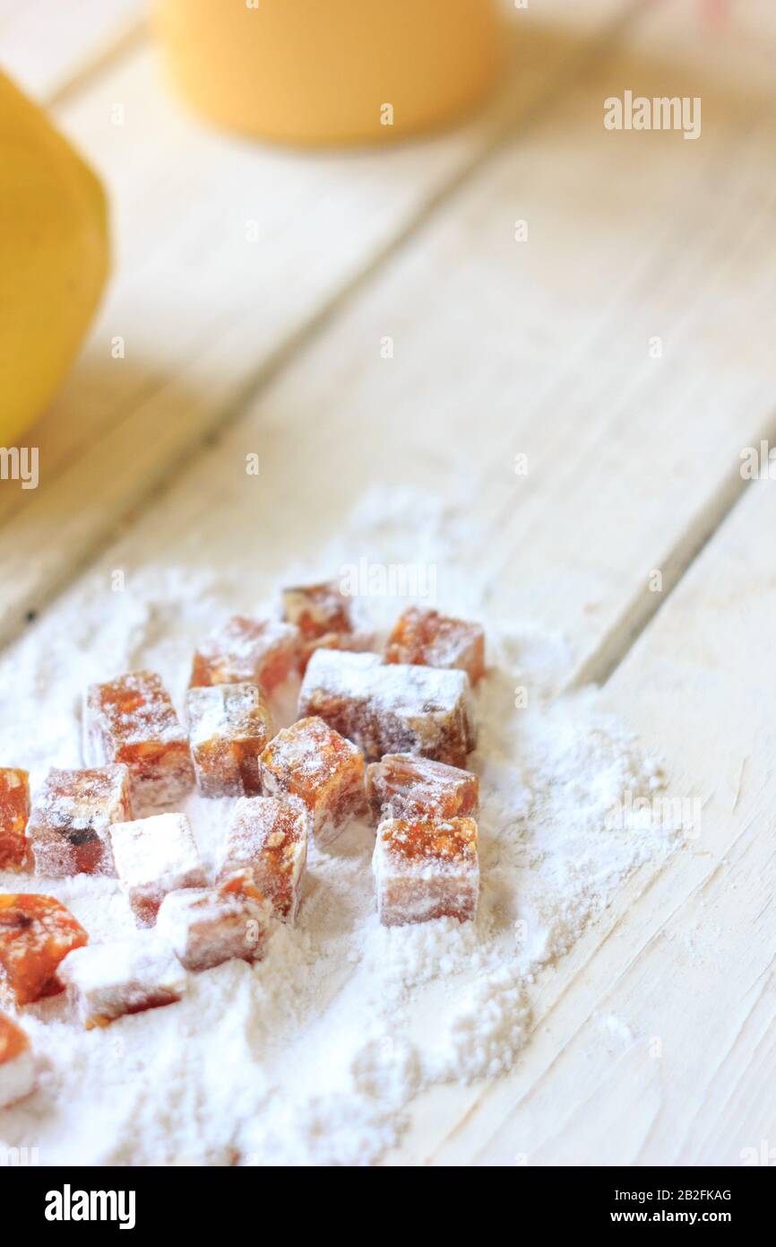 Pieces of quince jam in sugar powder Stock Photo Alamy
