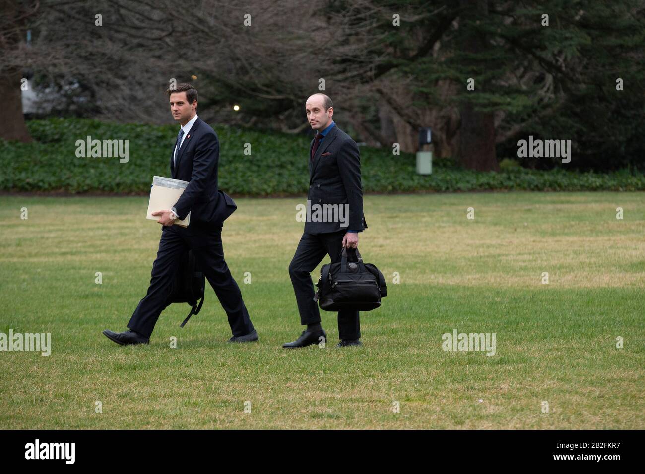 Charlotte, North Carolina. 2nd Mar, 2020. John Mcentee, personal aide to U.S. President Donald Trump, left, and Stephen Miller, White House senior advisor for policy, walk towards Marine One on the South Lawn of the White House in Washington, DC, U.S., on Monday, March 2, 2020, as United States President Donald J. Trump departs for a Keep America Great Rally in Charlotte, North Carolina. Credit: Stefani Reynolds/CNP | usage worldwide Credit: dpa/Alamy Live News Stock Photo