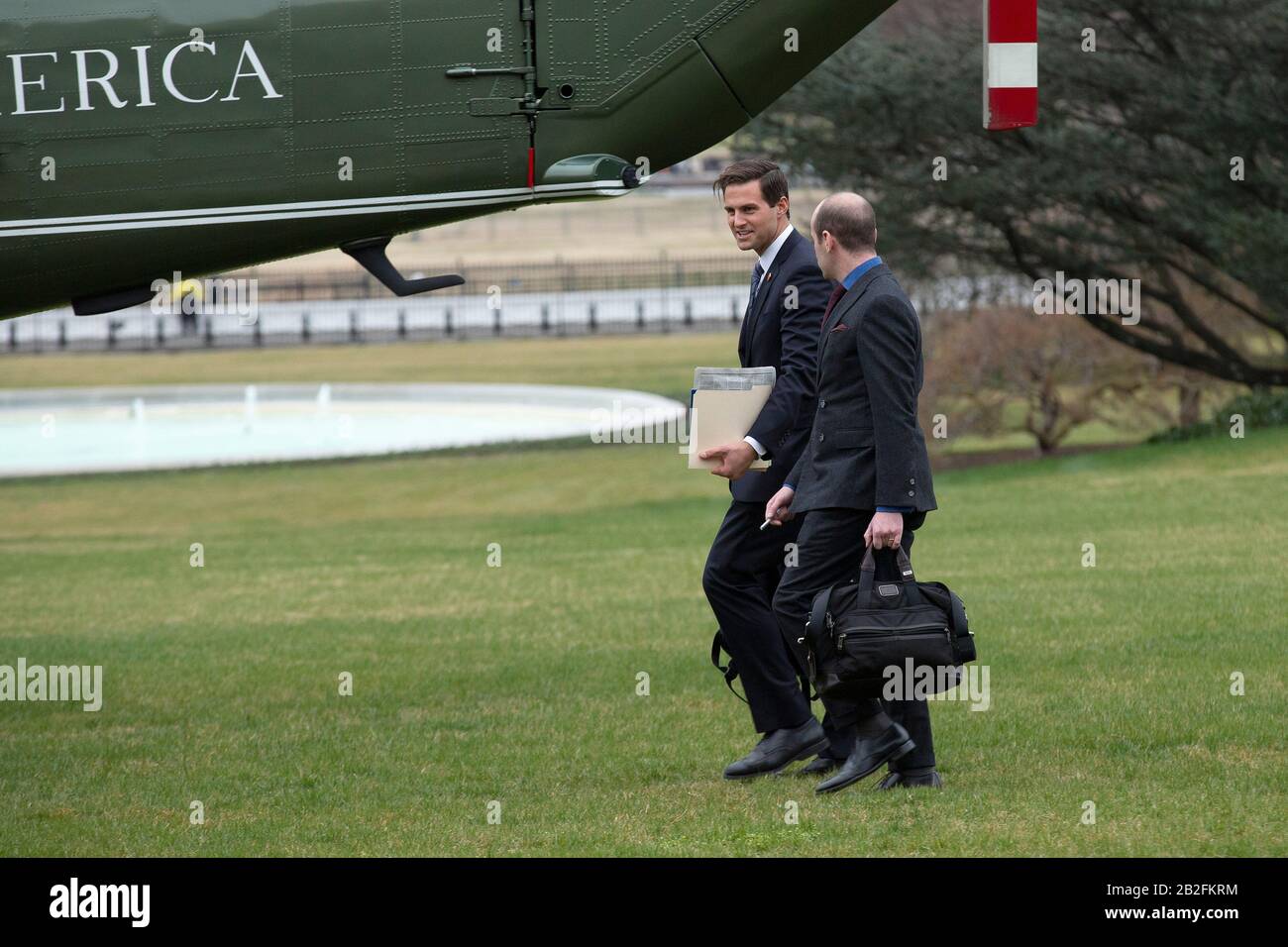 Charlotte, North Carolina. 2nd Mar, 2020. John Mcentee, personal aide to U.S. President Donald Trump, left, and Stephen Miller, White House senior advisor for policy, walk towards Marine One on the South Lawn of the White House in Washington, DC, U.S., on Monday, March 2, 2020, as United States President Donald J. Trump departs for a Keep America Great Rally in Charlotte, North Carolina. Credit: Stefani Reynolds/CNP | usage worldwide Credit: dpa/Alamy Live News Stock Photo