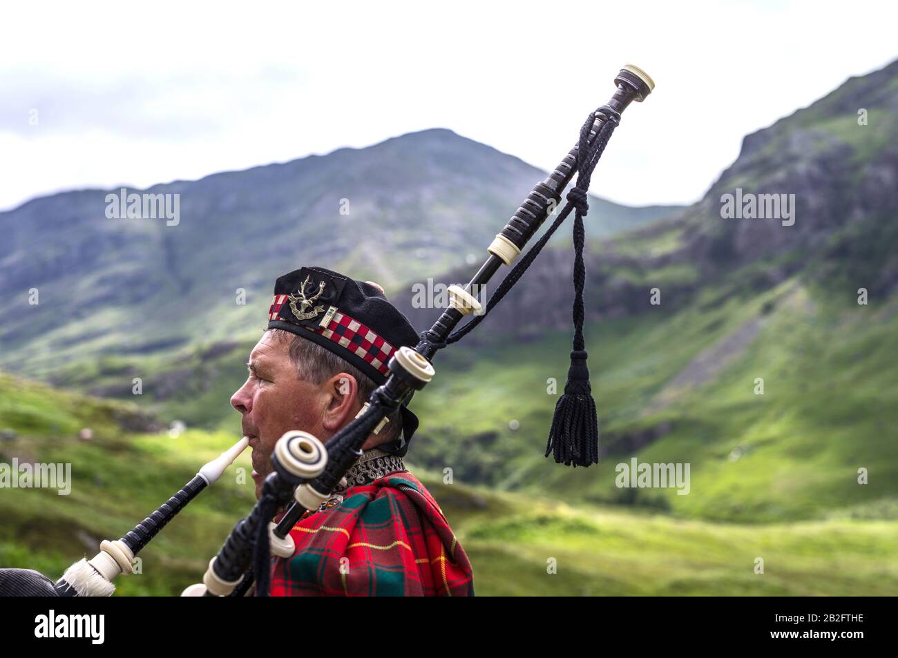 bagpipe player with wind blowing up skirt