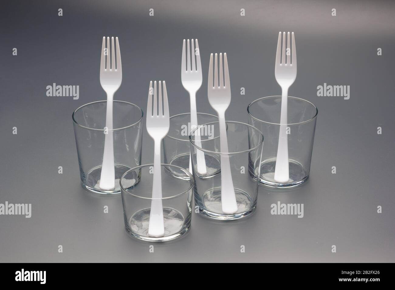 Forks of white color and constructed with recyclable plastic material