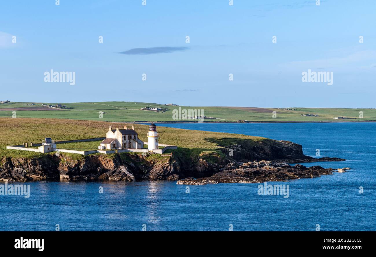Scoland, Orkney seascape with beacon at sunset Stock Photo