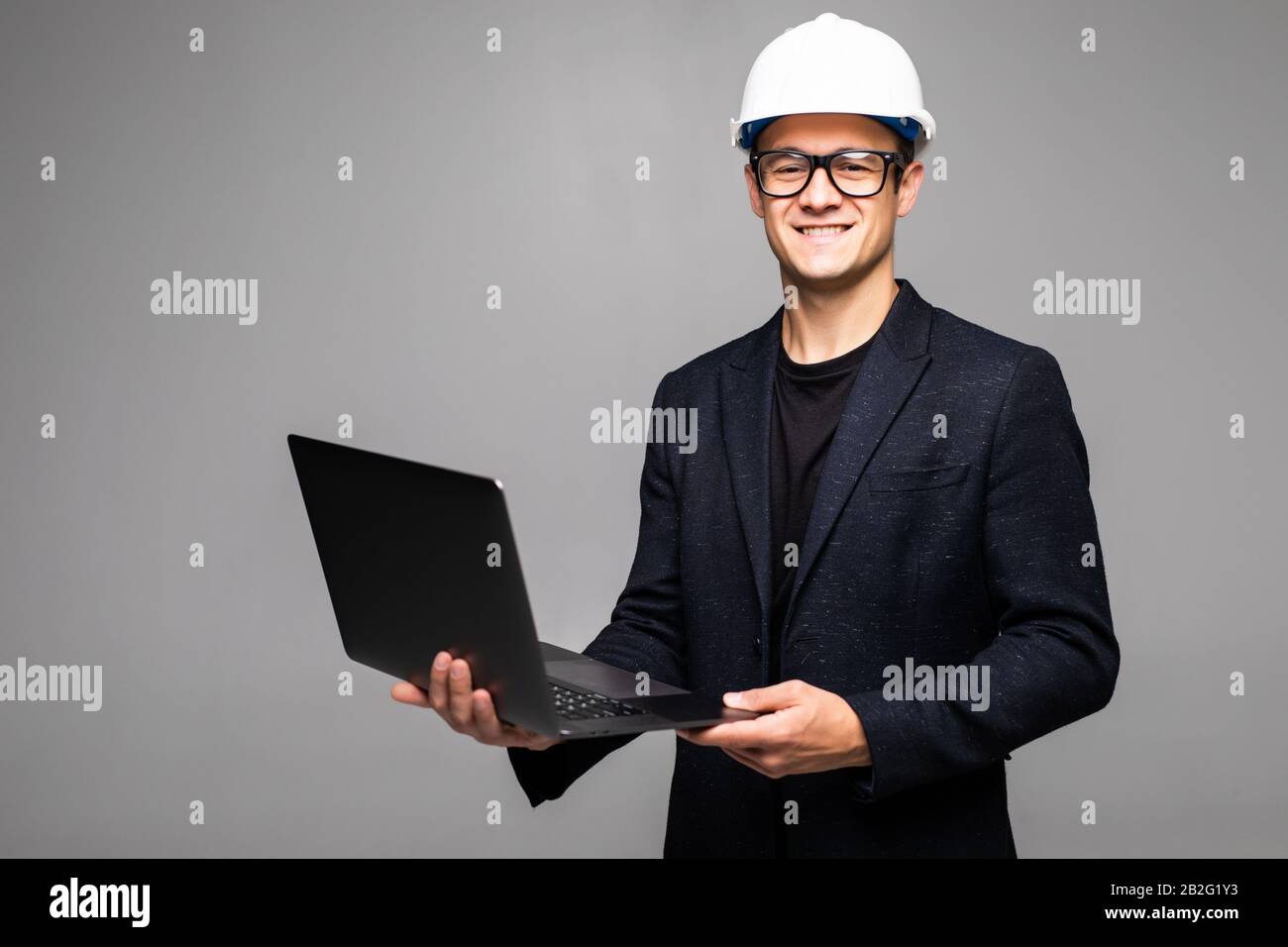 Portrait of an engineer using a laptop Stock Photo