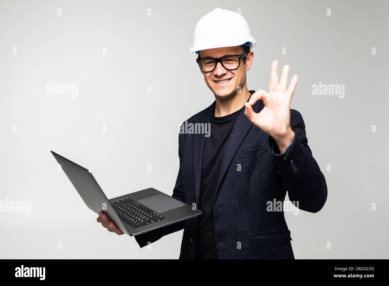 Portrait of an engineer using a laptop Stock Photo