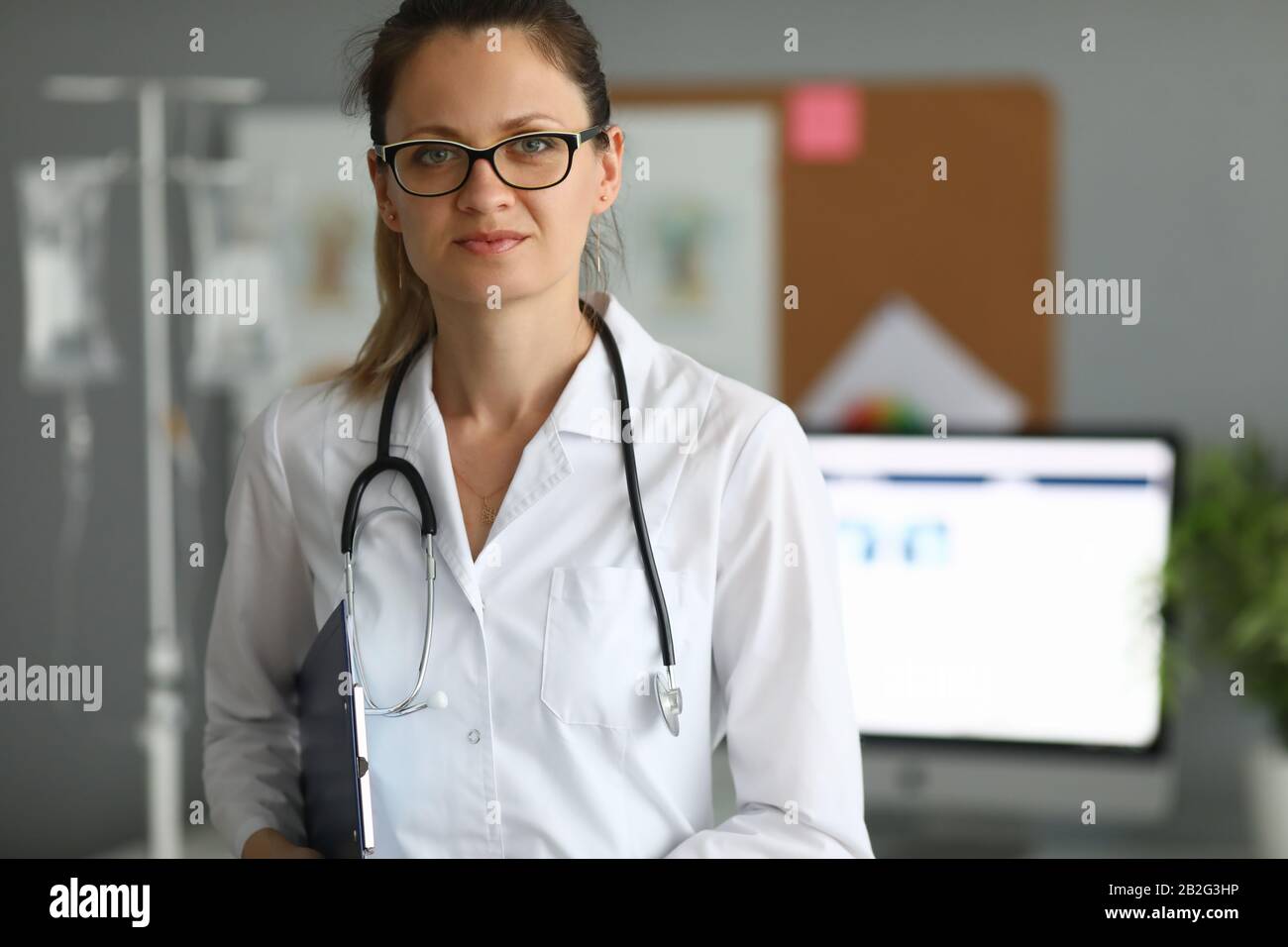 Doctor holding paper folder Stock Photo