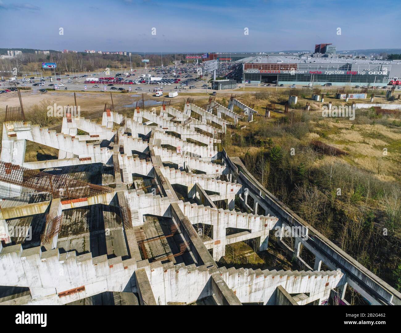 Shopping mall Akropolis next to unfinished Lithuanian National Stadium in Vilnius, Seskine, Lithuania Stock Photo