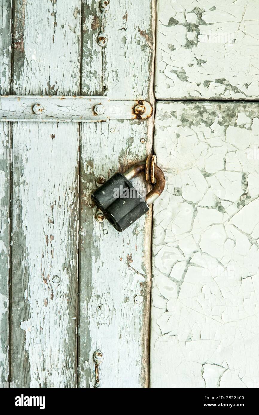 White wooden wall door with the metal lock Stock Photo - Alamy