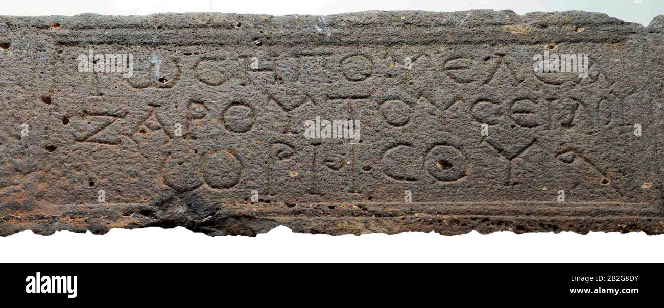 6648. Greek inscription from a byzantine church in Tiberias. Text on the basalt stone reads: 'Joseph son of Elazar son of Sello of Oresos' Stock Photo