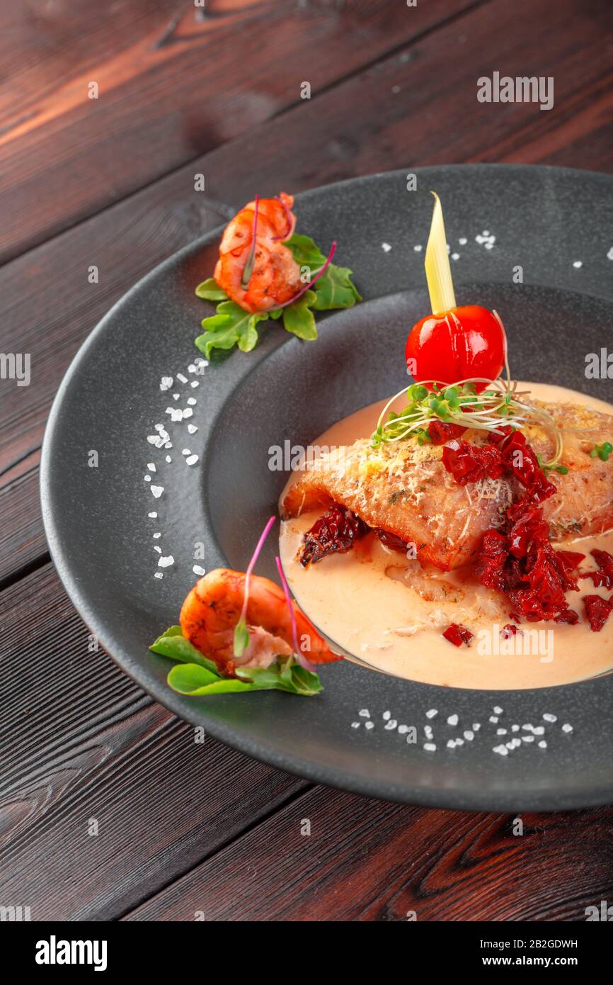 Stuffed squid with parmesan cheese, onion and parsley in tomato sauce