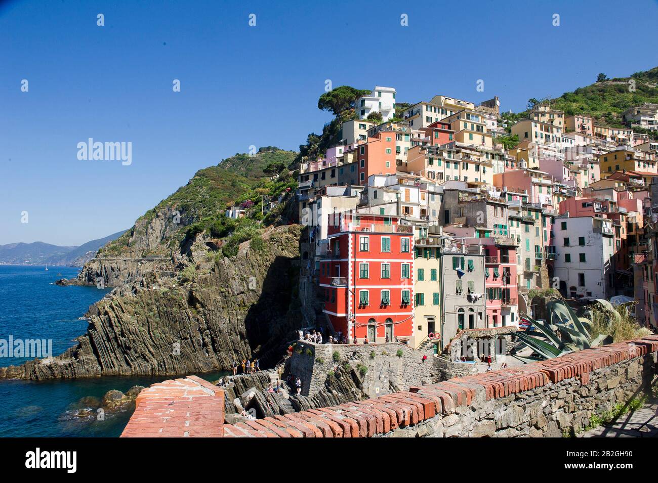 Riomaggiore overlooks the sea in the province of La Spezia, is in the natural park of the Cinque Terre in Liguria, in north-western Italy. It is on the UNESCO World Heritage list Stock Photo