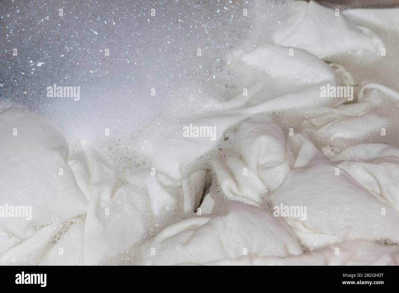White linen in the washing machine Stock Photo Alamy
