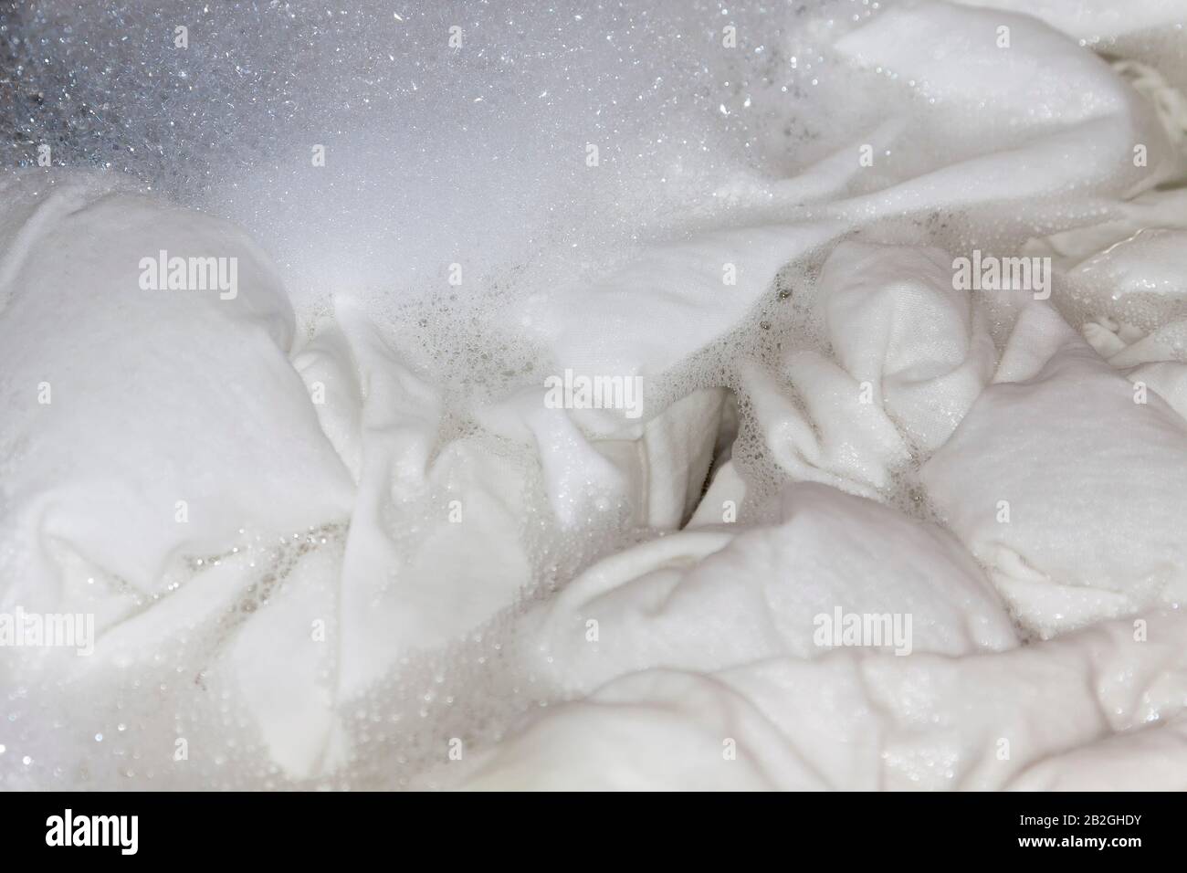 White linen in the washing machine Stock Photo Alamy