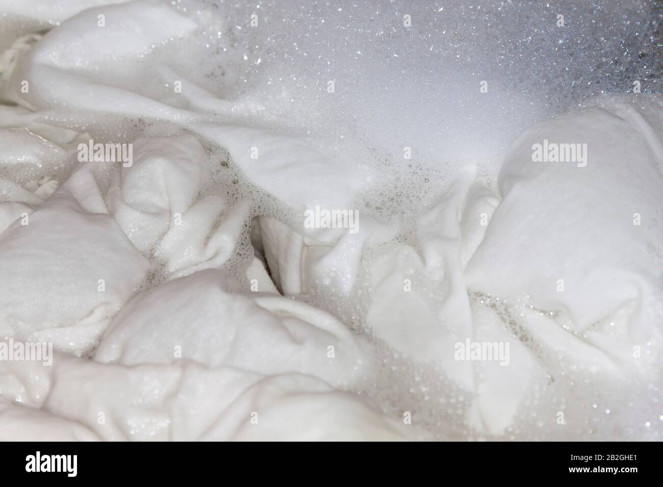 White linen in the washing machine Stock Photo Alamy