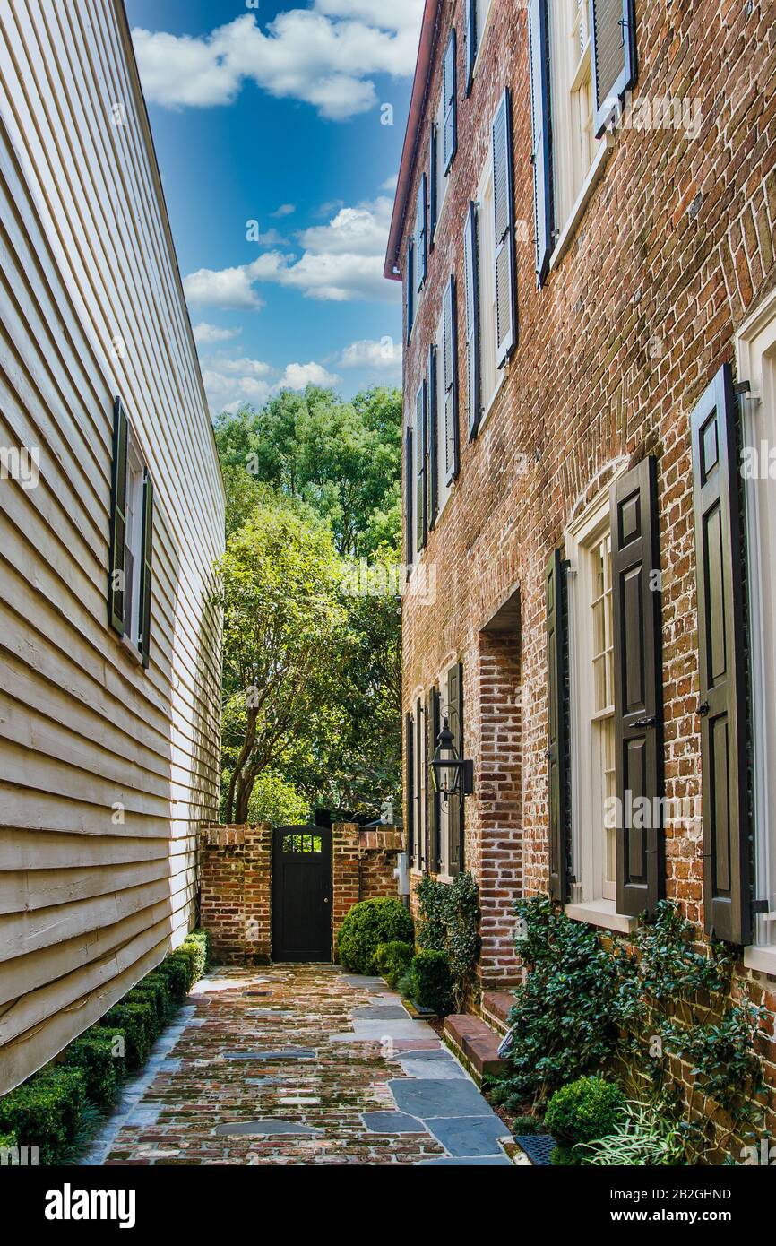 Brick Walkway Between Brick and Siding Homes Stock Photo Alamy