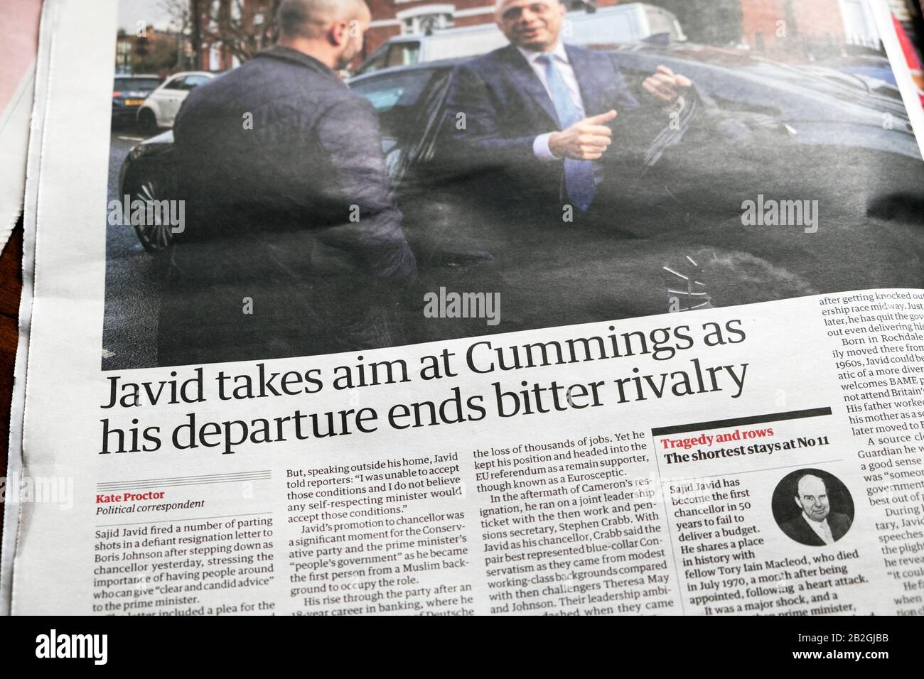 'Javid takes aim at Cummings as his departure ends bitter rivalry' Guardian newspaper headline in article inside paper on 14 February 2020 London UK Stock Photo