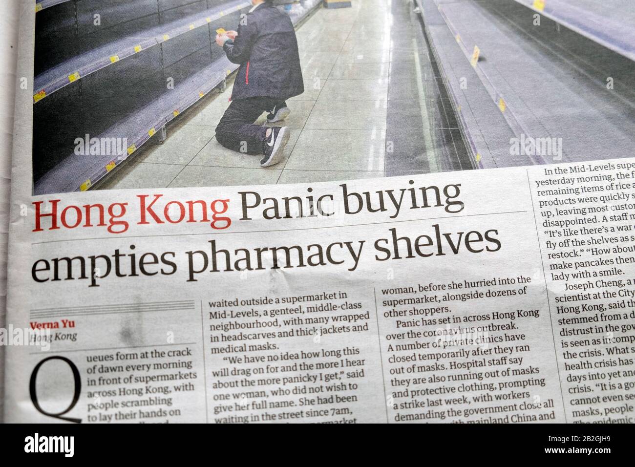 Empty shelves in supermarket & pharmacy article 'Hong Kong: Panic buying empties pharmacy shelves' in Guardian newspaper 13 February 2020 UK Stock Photo