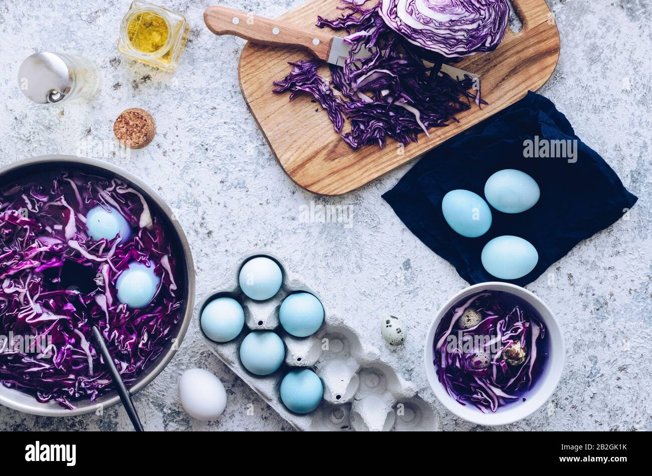 Dyed blue Easter eggs painted with natural dye red cabbage on grey ...