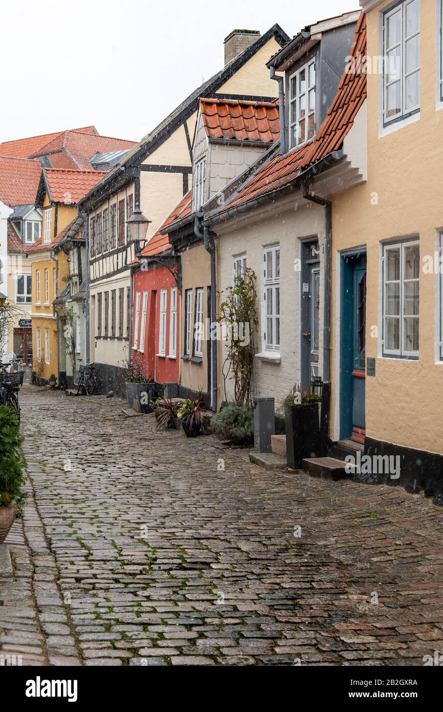 Pretty, colourful cottages in Aalborg, Denmark, on a snowy, winters day. Stock Photo
