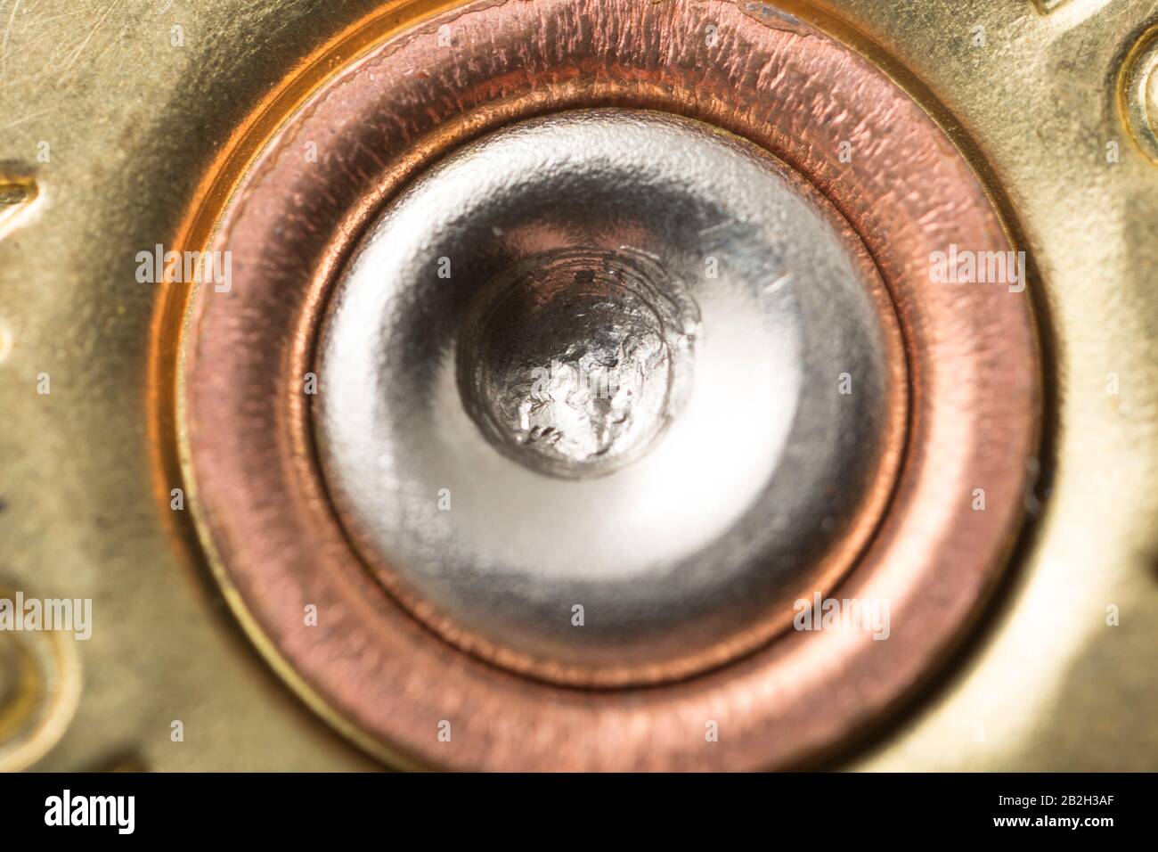 An example of a fired shotgun cartridge showing the dent in the primer