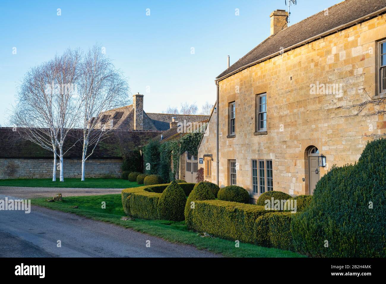 Manor farm house in the afternoon winter sunlight. Broadway, Cotswolds, Worcestershire, England Stock Photo
