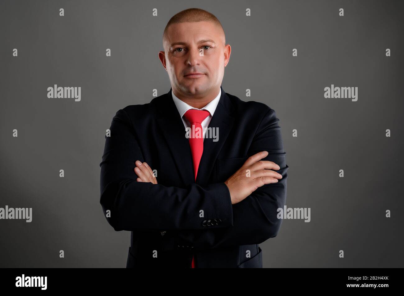 Businessman dressed in black suit showing confidence Stock Photo - Alamy