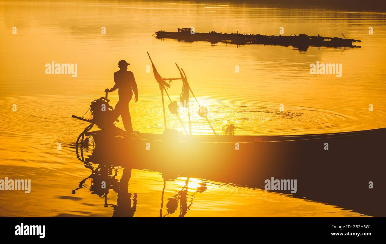 Silhouette fishing boat hi-res stock photography and images - Alamy