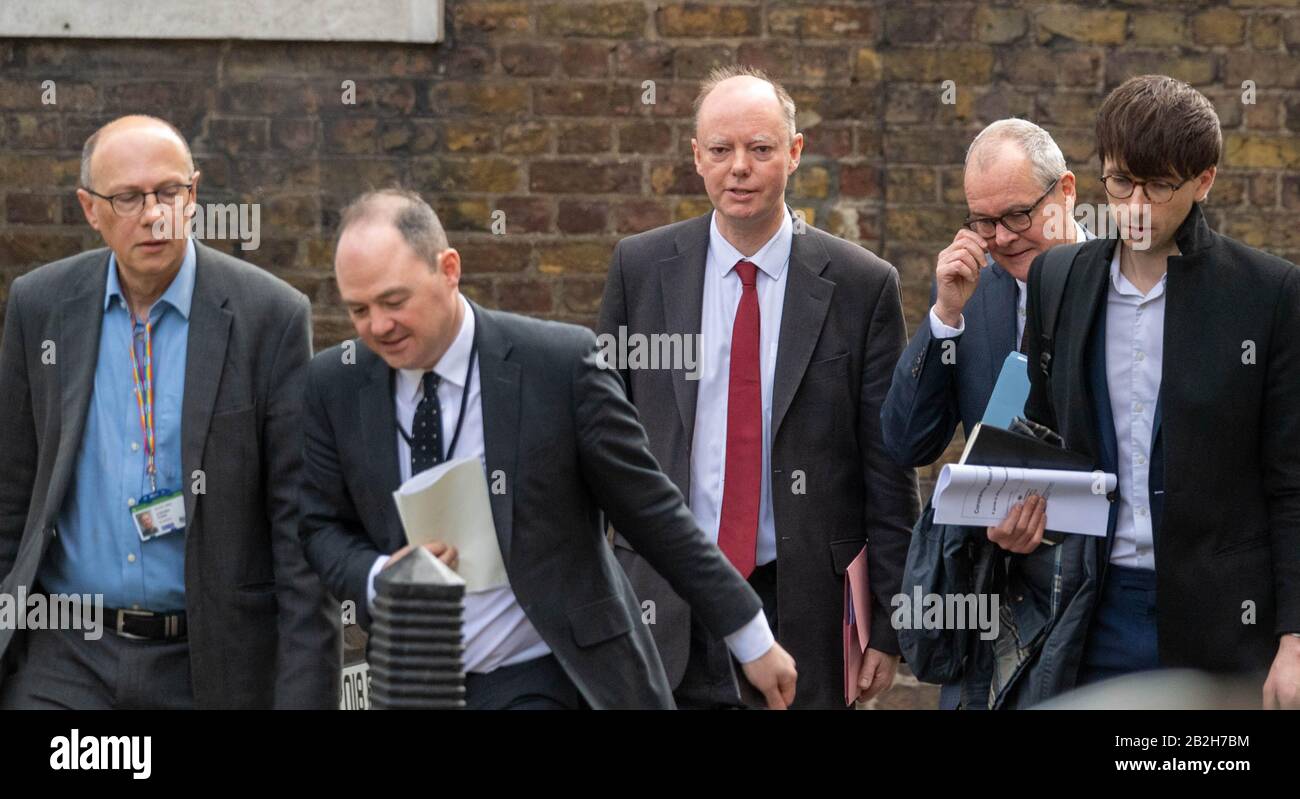 London, UK. 3rd Mar, 2020. Chris Whitty(center red tie) returns to 10 Downing Street, London, with other medical experts, ahead of a press conference on the coronavirus Credit: Ian Davidson/Alamy Live News Stock Photo