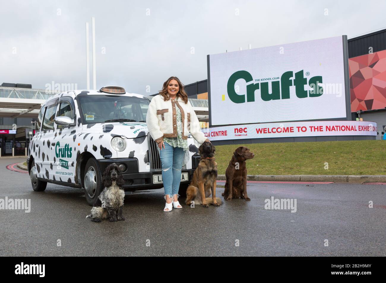 Birmingham NEC, UK. 3rd Mar, 2020. Scarlett Moffatt, star of Gogglebox and I'm a Celebrity, arrives in style in a Dalmation themed taxi at Crufts 2020, NEC Birmingham, to start preparations for the new Crufts Extra Youtube show. Crufts 2020 runs from 5th to 8th March. Credit: Peter Lopeman/Alamy Live News Stock Photo