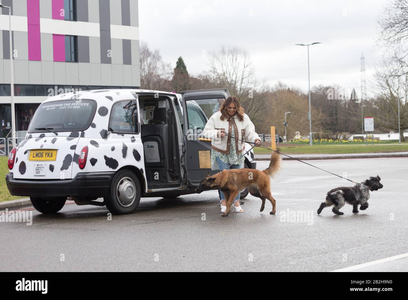 Birmingham NEC, UK. 3rd Mar, 2020. Scarlett Moffatt, star of Gogglebox and I'm a Celebrity, arrives in style in a Dalmation themed taxi at Crufts 2020, NEC Birmingham, to start preparations for the new Crufts Extra Youtube show. Crufts 2020 runs from 5th to 8th March. Credit: Peter Lopeman/Alamy Live News Stock Photo