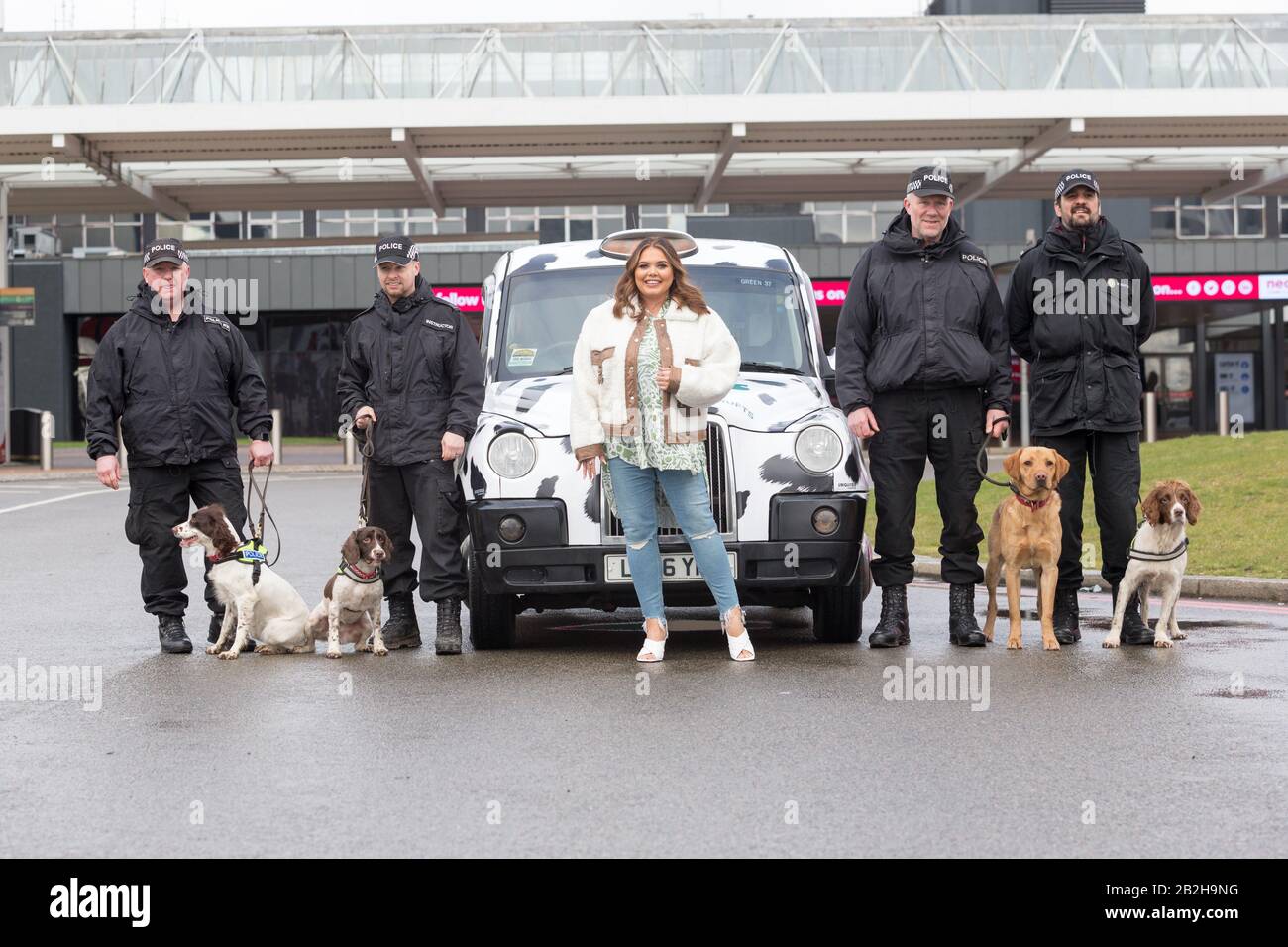 Birmingham NEC, UK. 3rd Mar, 2020. Scarlett Moffatt, star of Gogglebox and I'm a Celebrity, arrives in style in a Dalmation themed taxi at Crufts 2020, NEC Birmingham, with the West Midlands Police Dog Unit, to start preparations for the new Crufts Extra Youtube show. Crufts 2020 runs from 5th to 8th March. Credit: Peter Lopeman/Alamy Live News Stock Photo