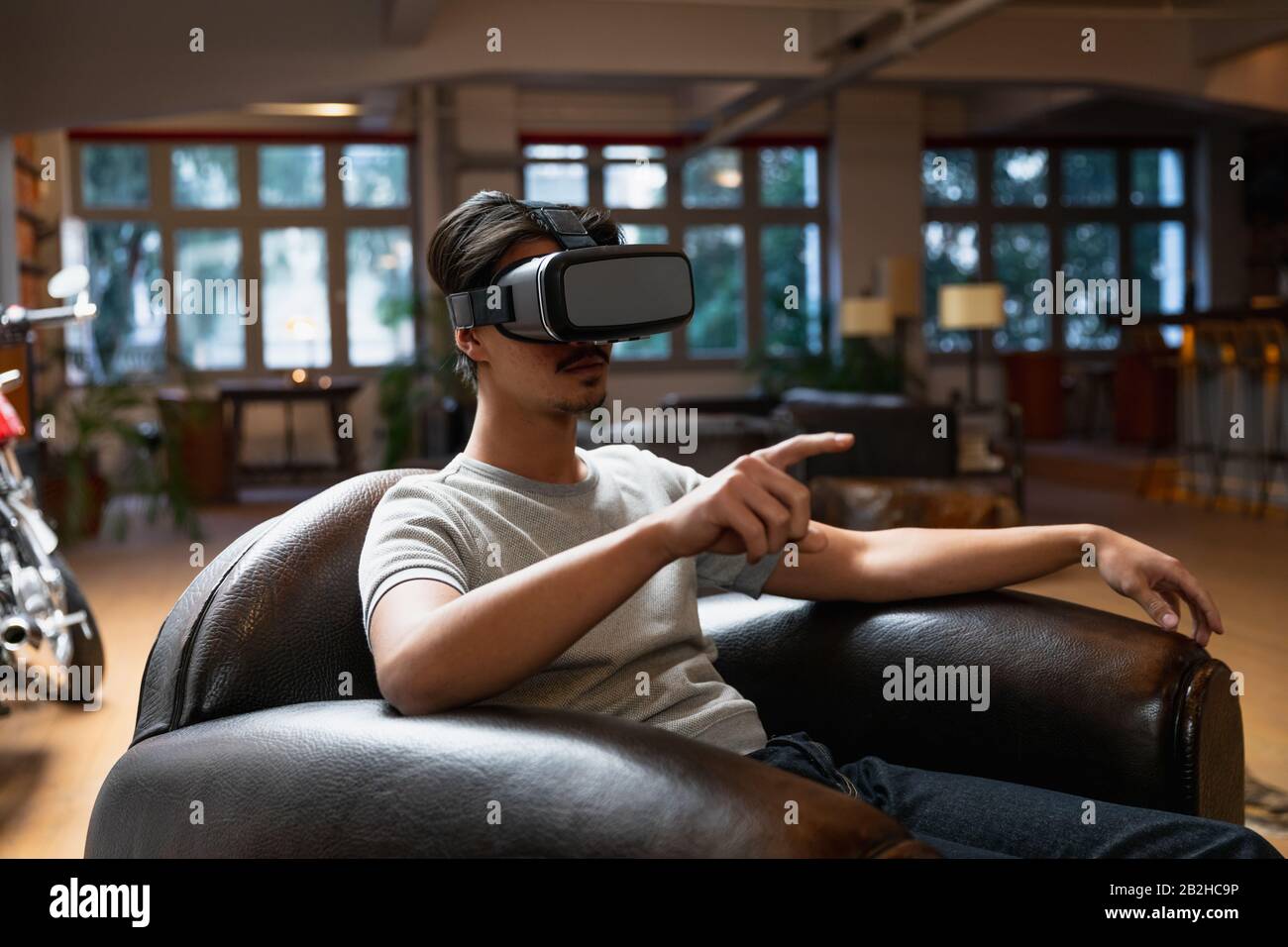 Young man using a VR headset Stock Photo