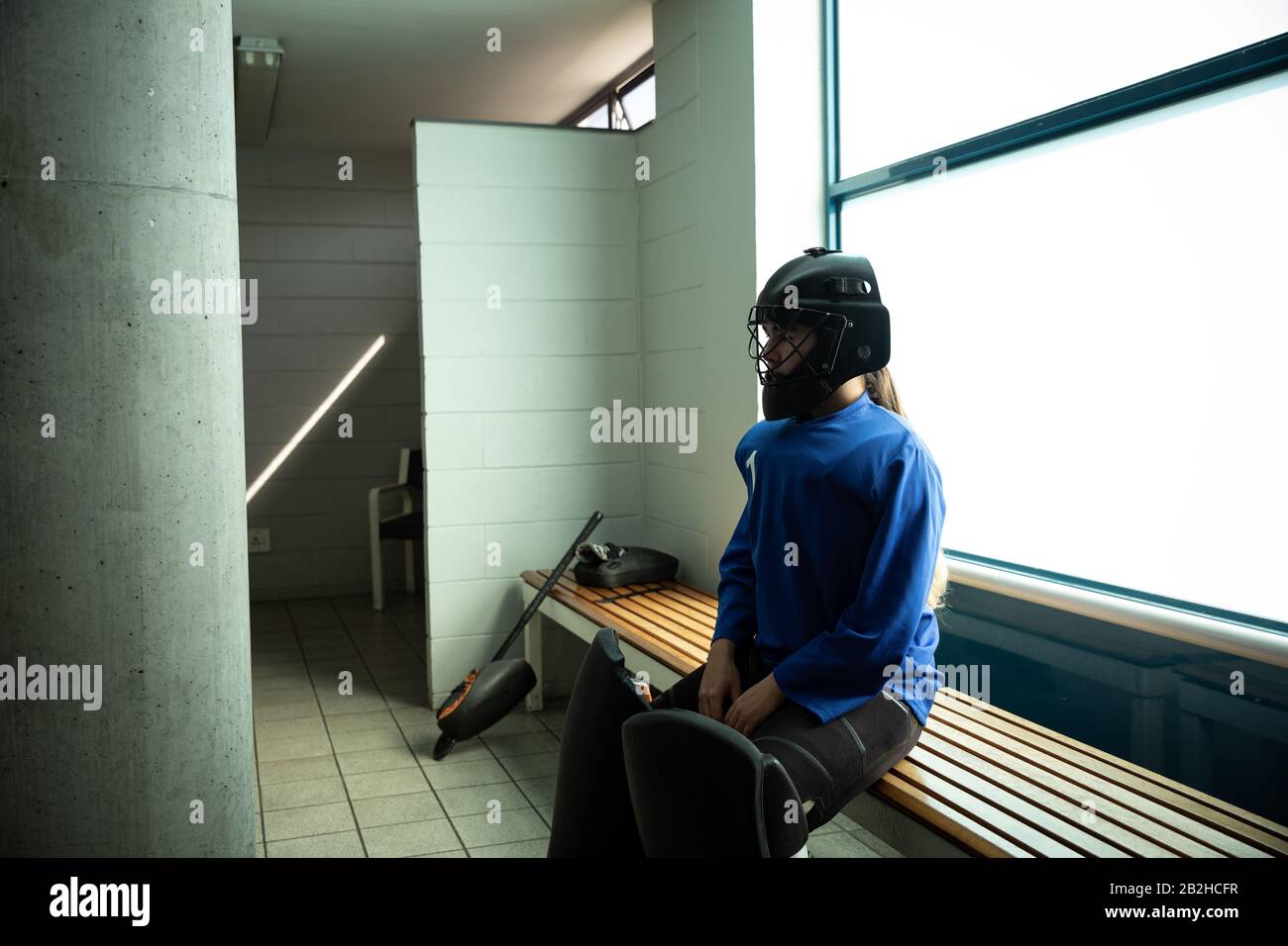 Female hockey player in a cloakroom Stock Photo