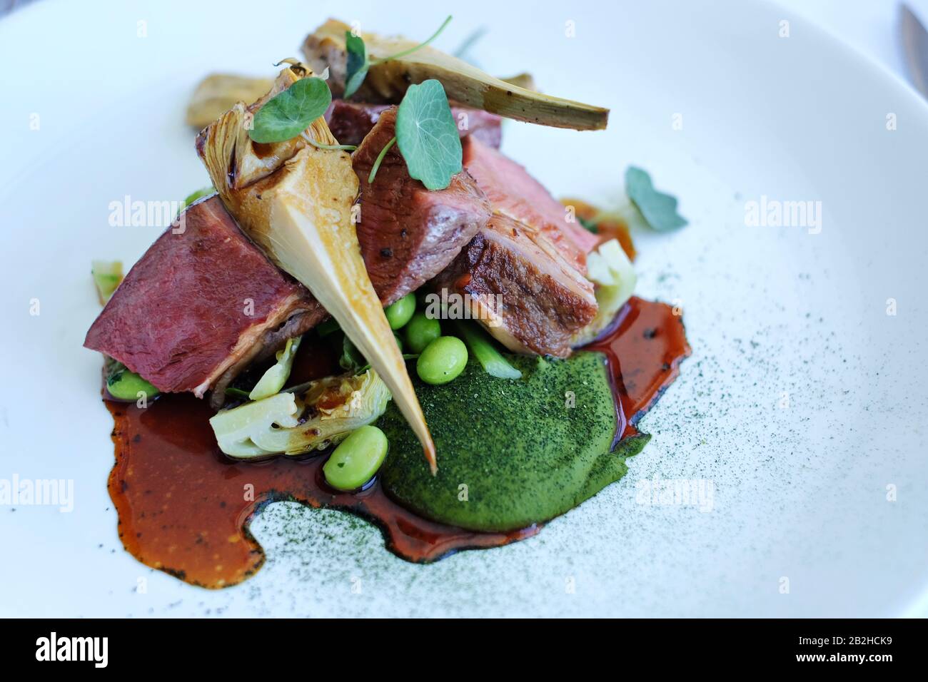 Lamb and green beans. Lunch At Icebergs Dining Room And Bar, Fine Dining, Bondi Beach, Sydney, Australia Stock Photo