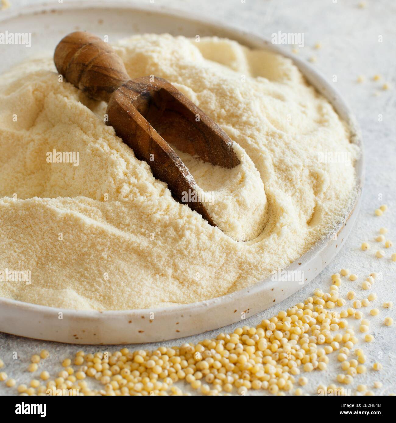 Hulled millet flour and grain close up Stock Photo Alamy