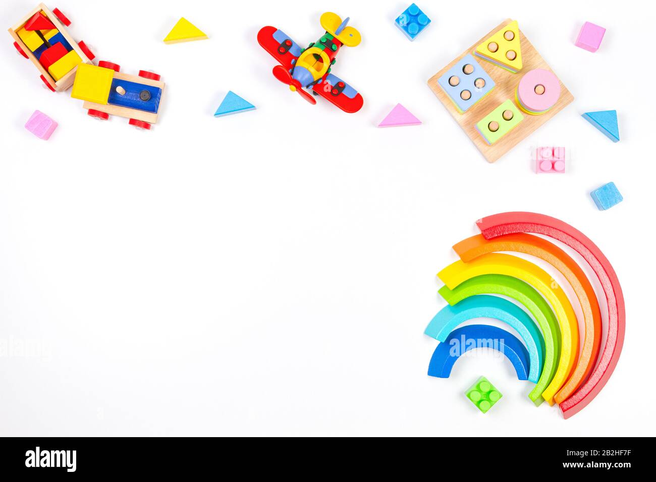 Baby kids toys background. Wooden educational geometric stacking blocks ...