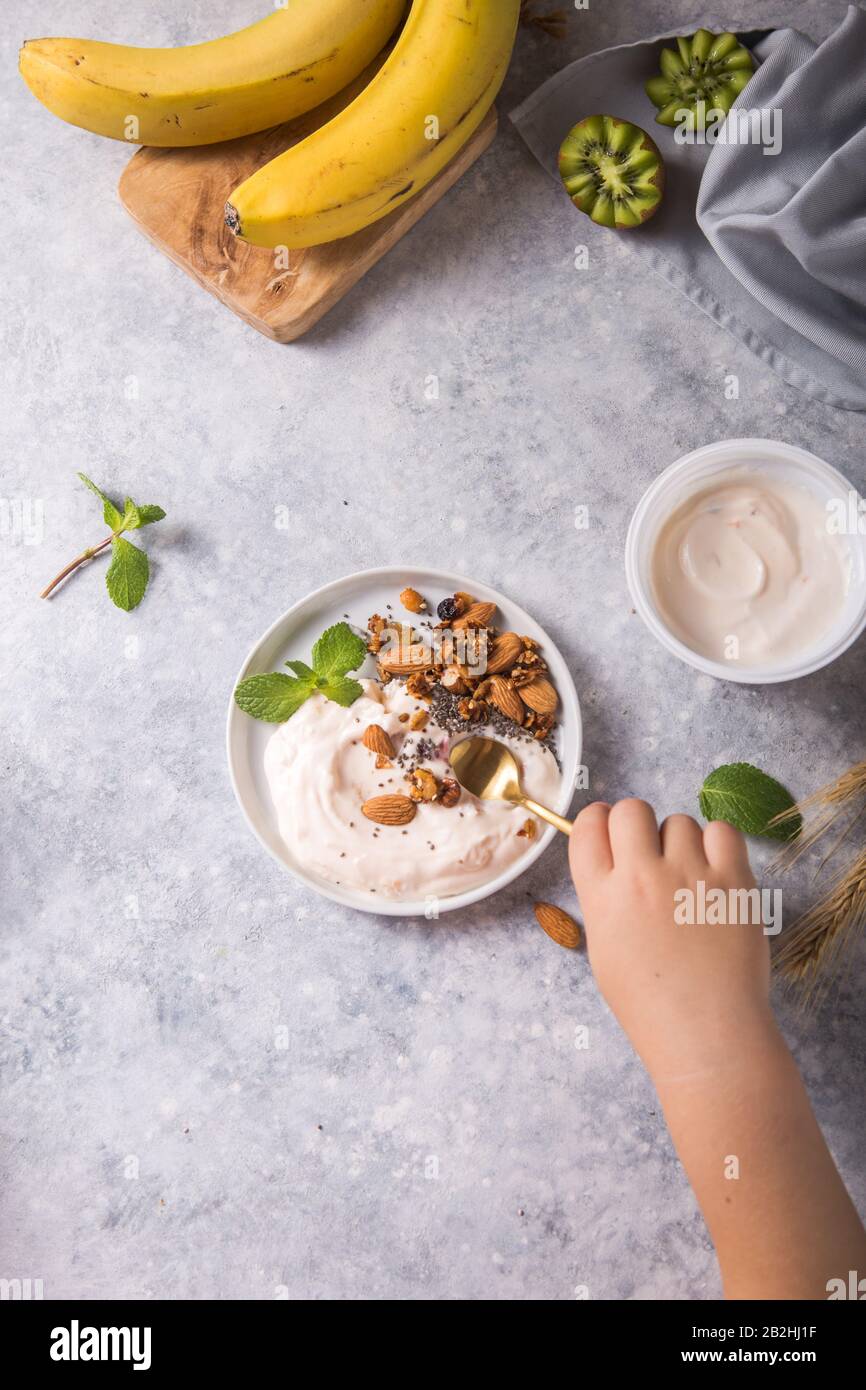 yogurt with almond nuts and fruits for healthy breakfast Stock Photo