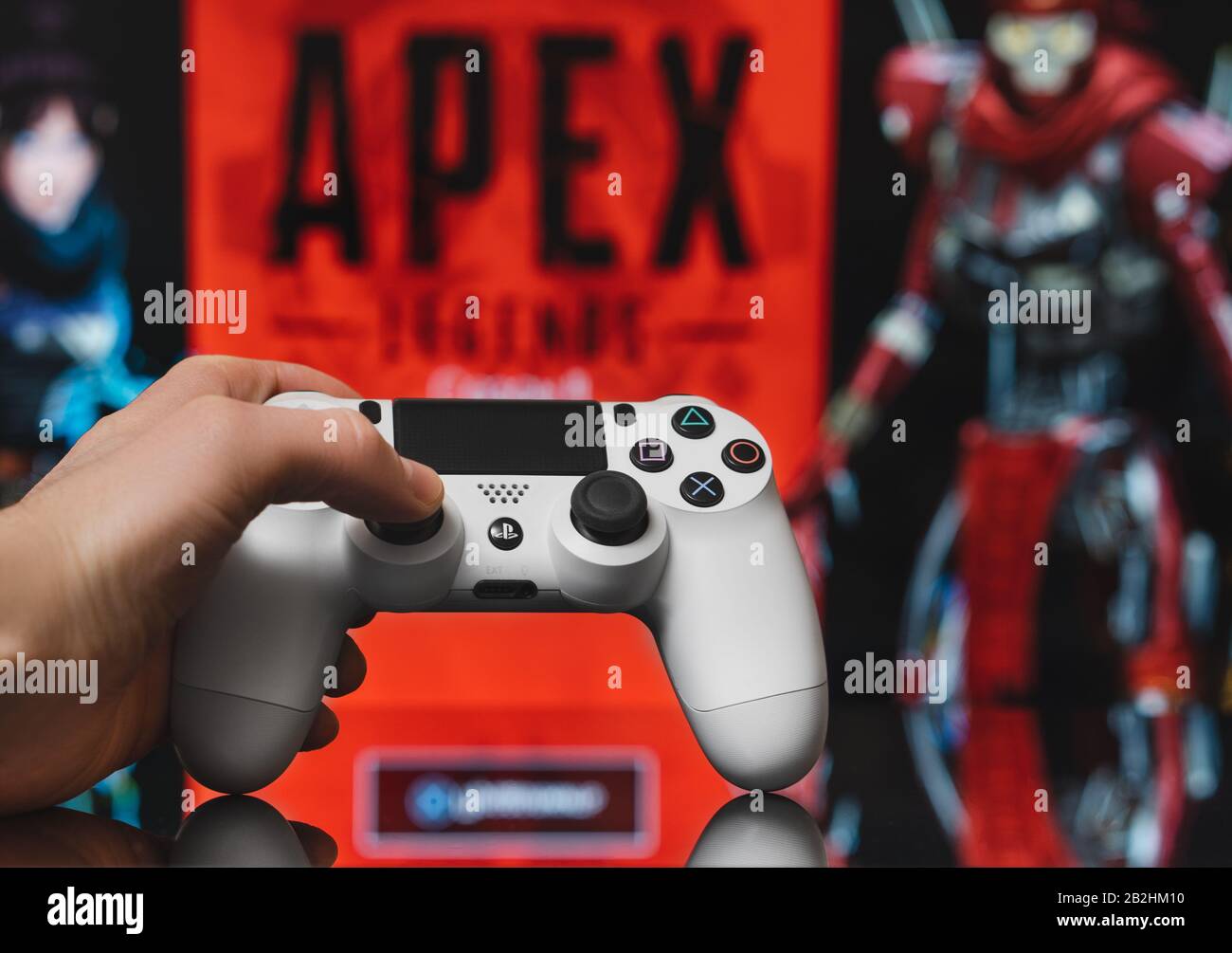 Odessa, Ukraine - February 9, 2020. White playstation 4 gamepad on the  background of the game APEX Legends from EA Games. Apex Legends free to  play Ba Stock Photo - Alamy