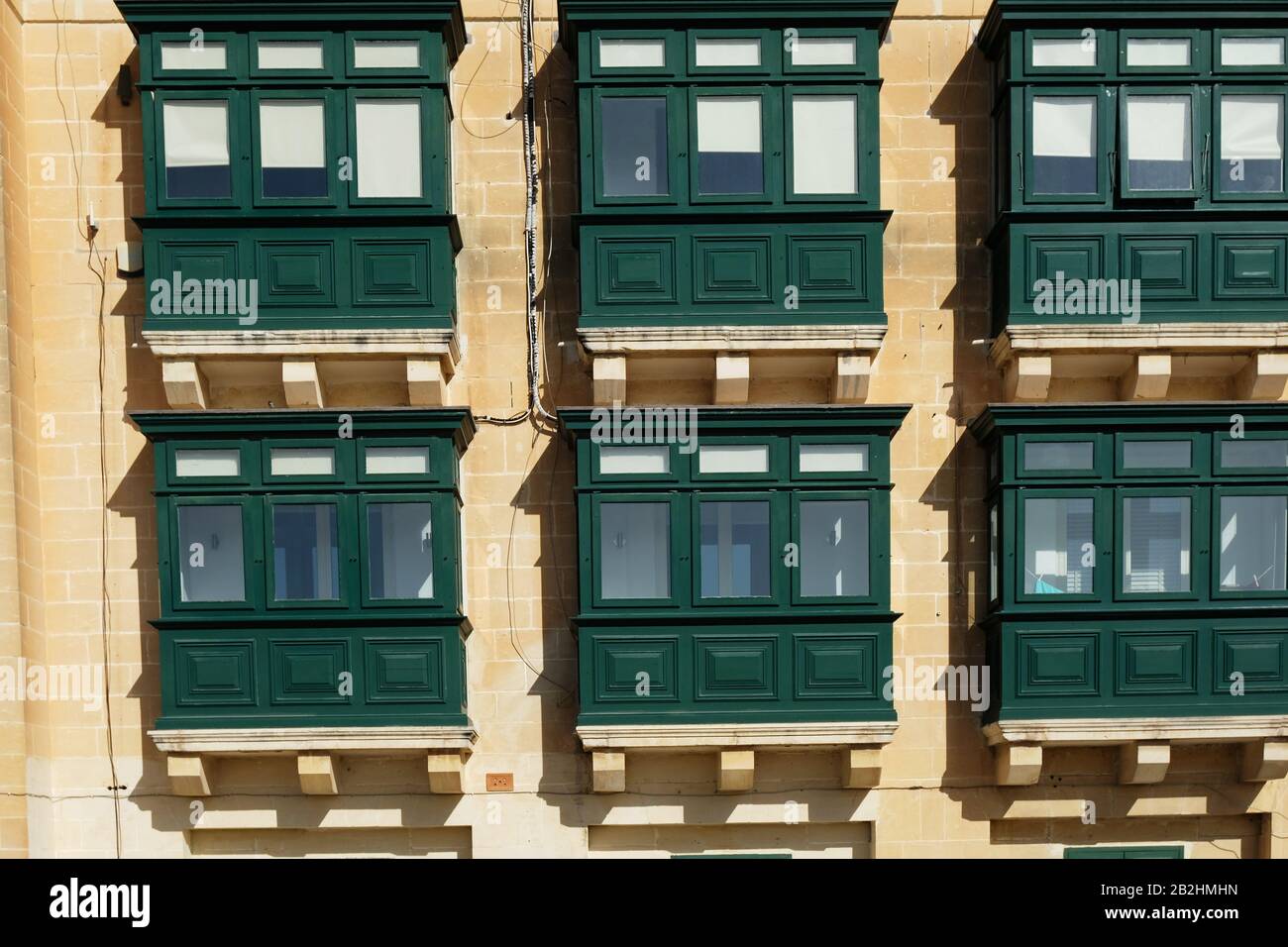 Green balconies- typical architecural feature of Valletta, capital of Malta Stock Photo