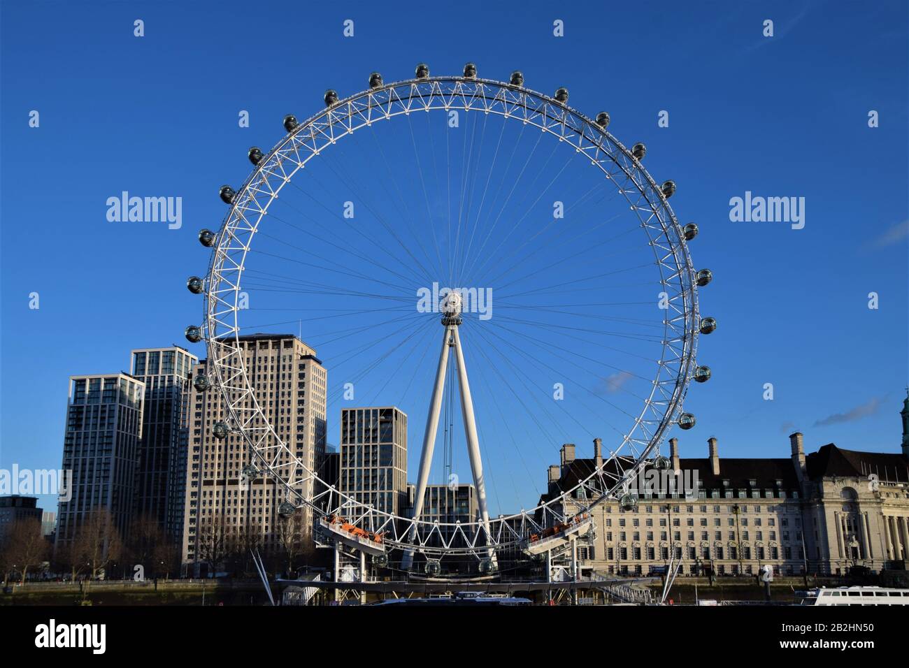London Eye and County Hall with clear blue sky Stock Photo - Alamy