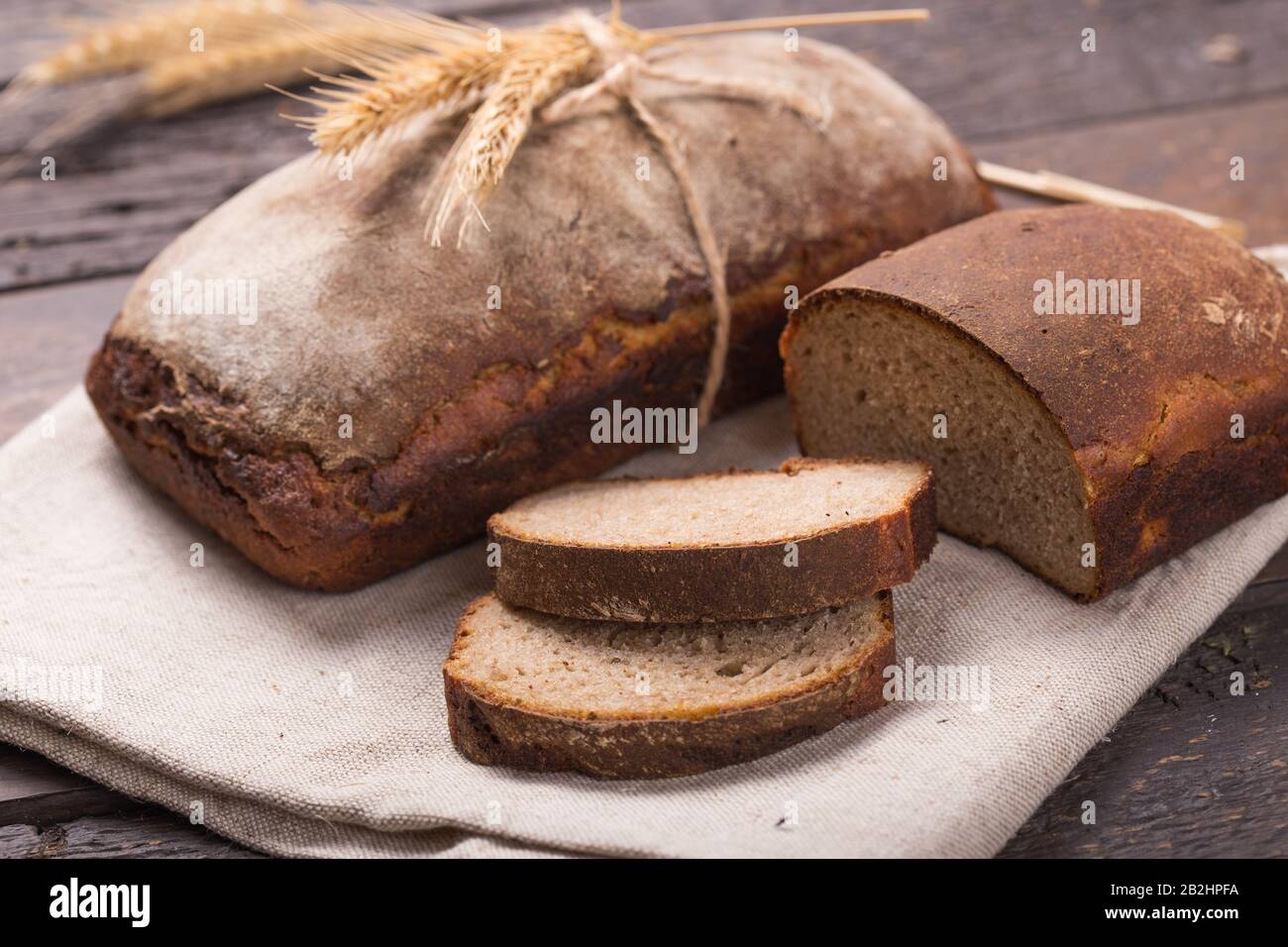 Homemade loaf of organic fermented malt bread cooked at home Stock