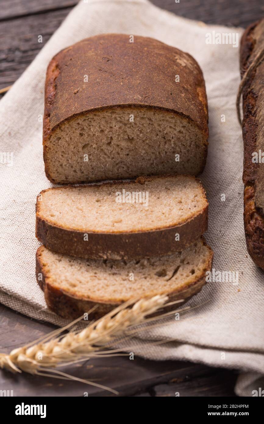 Homemade loaf of organic fermented malt bread cooked at home Stock