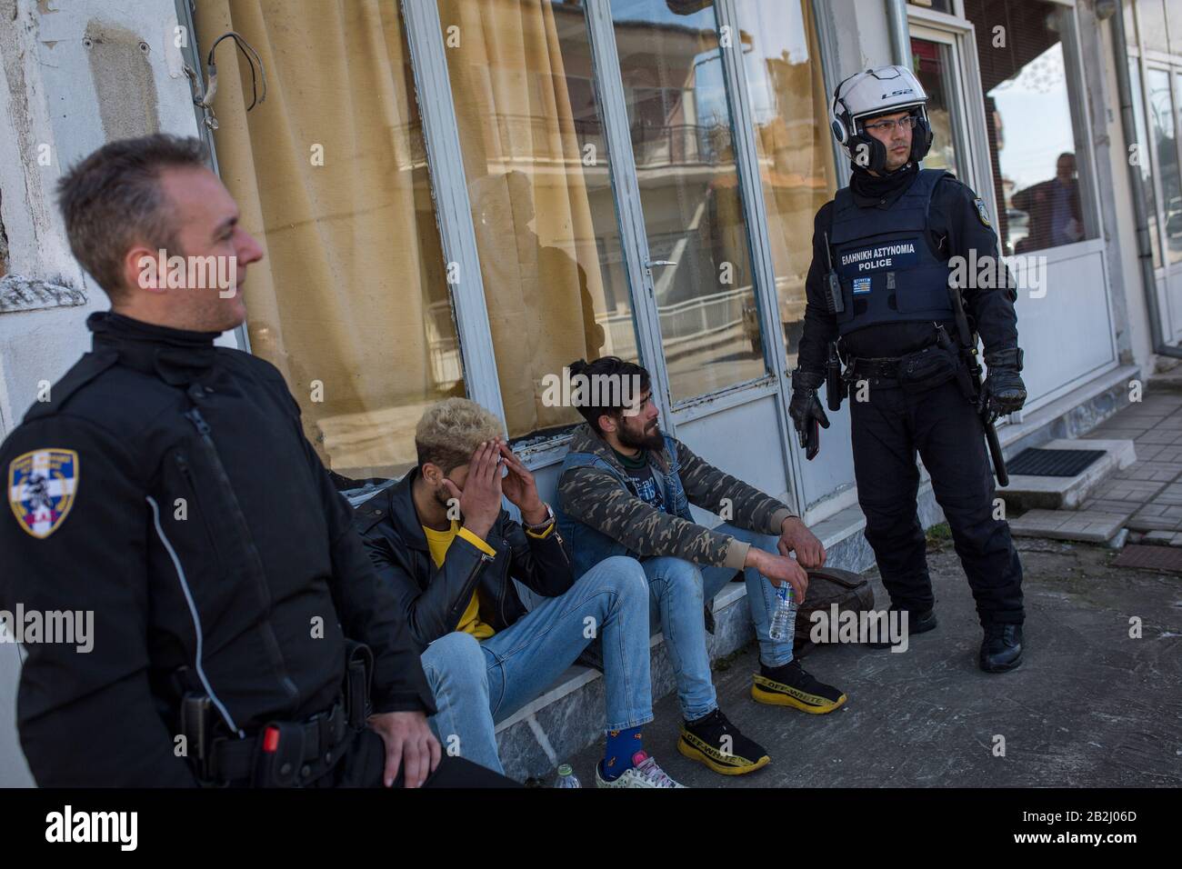 Kastanies, Greece. 03rd Mar, 2020. Greek police officers are holding two  apprehended migrants in the village of Kastanies near the Greek-Turkish  border. Credit: Socrates Baltagiannis/dpa/Alamy Live News Stock Photo -  Alamy