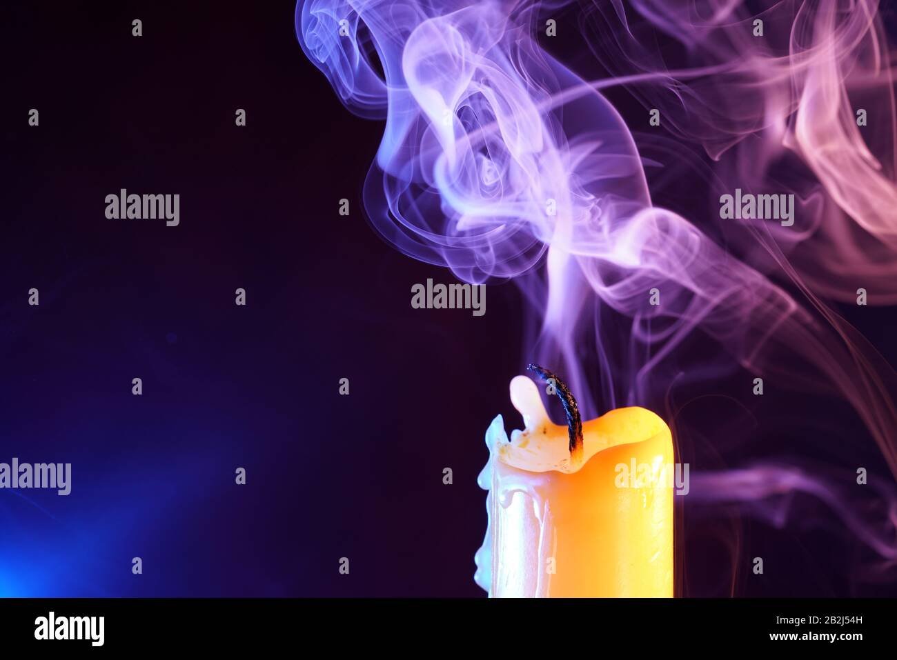 Candle after blowing out the flame photographed with colorful flashes