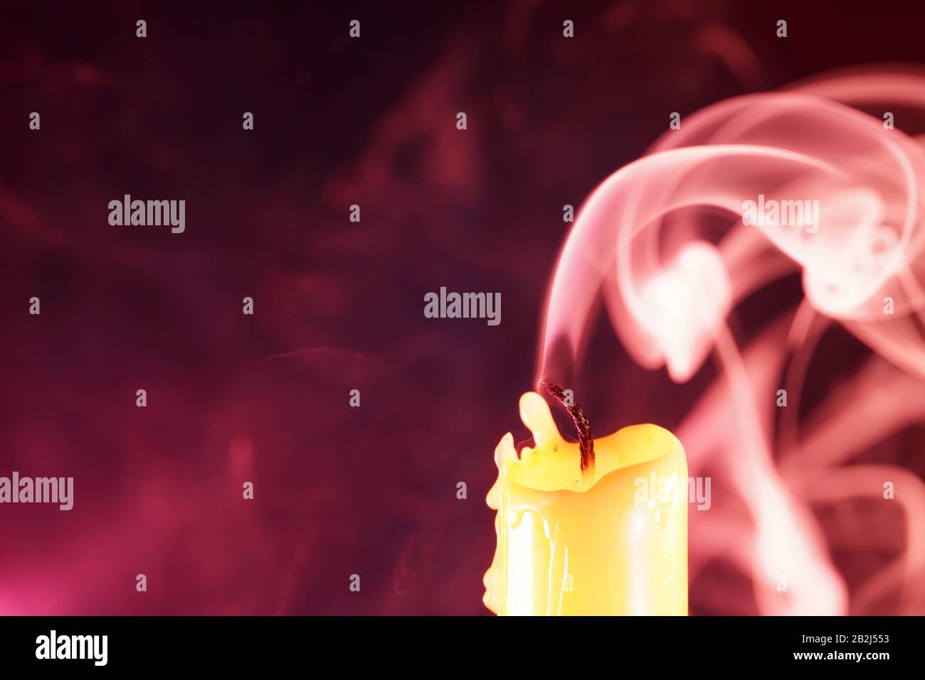 Candle after blowing out the flame photographed with colorful flashes