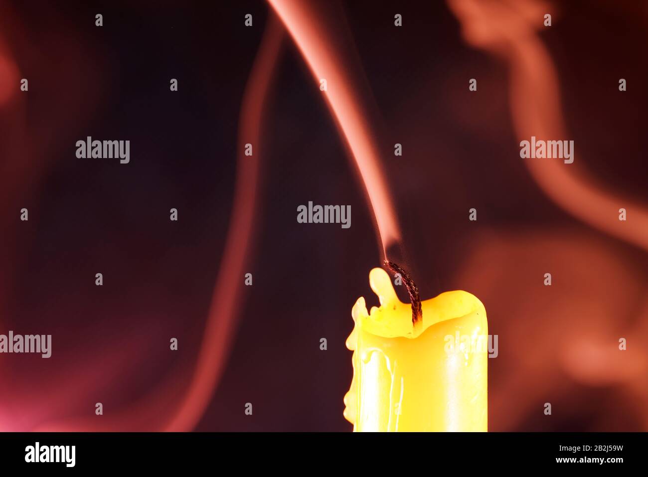 Candle after blowing out the flame photographed with colorful flashes