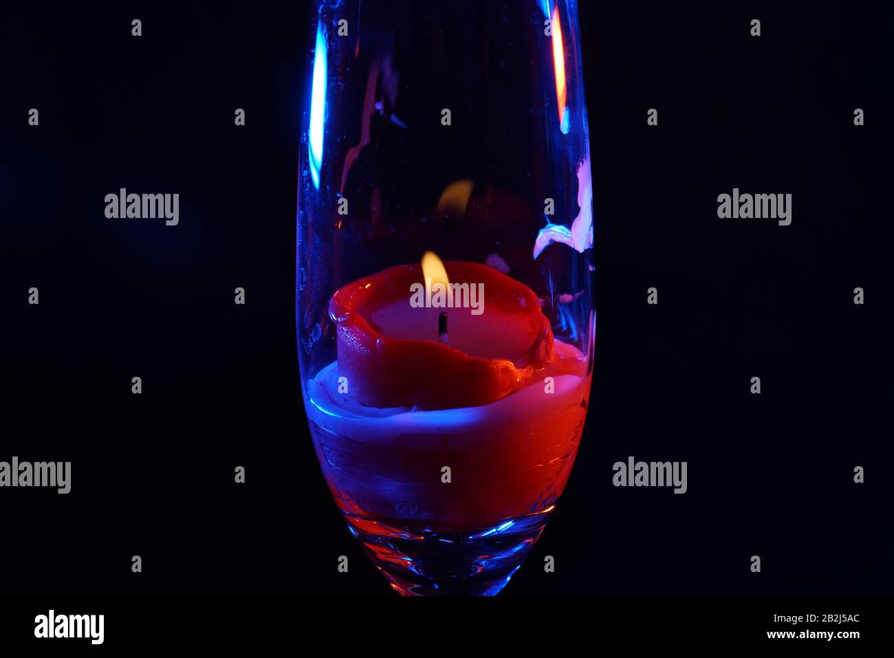 Candle after blowing out the flame photographed with colorful flashes