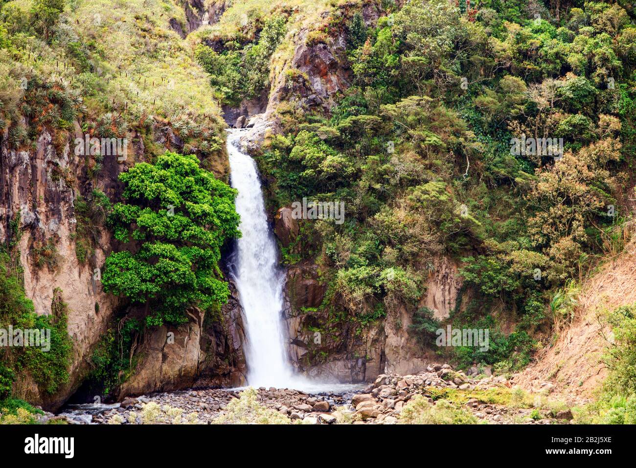 30M High Waterfall Near Banos Ecuador Offer Perfect Bath Place And Rock Climbing Stock Photo