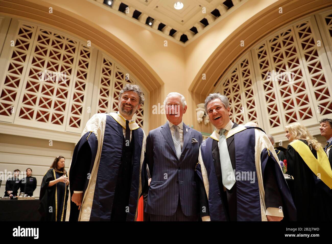 The Prince of Wales with German operatic tenor Jonas Kaufmann (left) and English-Italian conductor and pianist Sir Antonio Pappano during a reception in the new Performance Hall, after presenting them with honorary Doctor of Music awards at the Royal College of Music's annual awards in London. Stock Photo