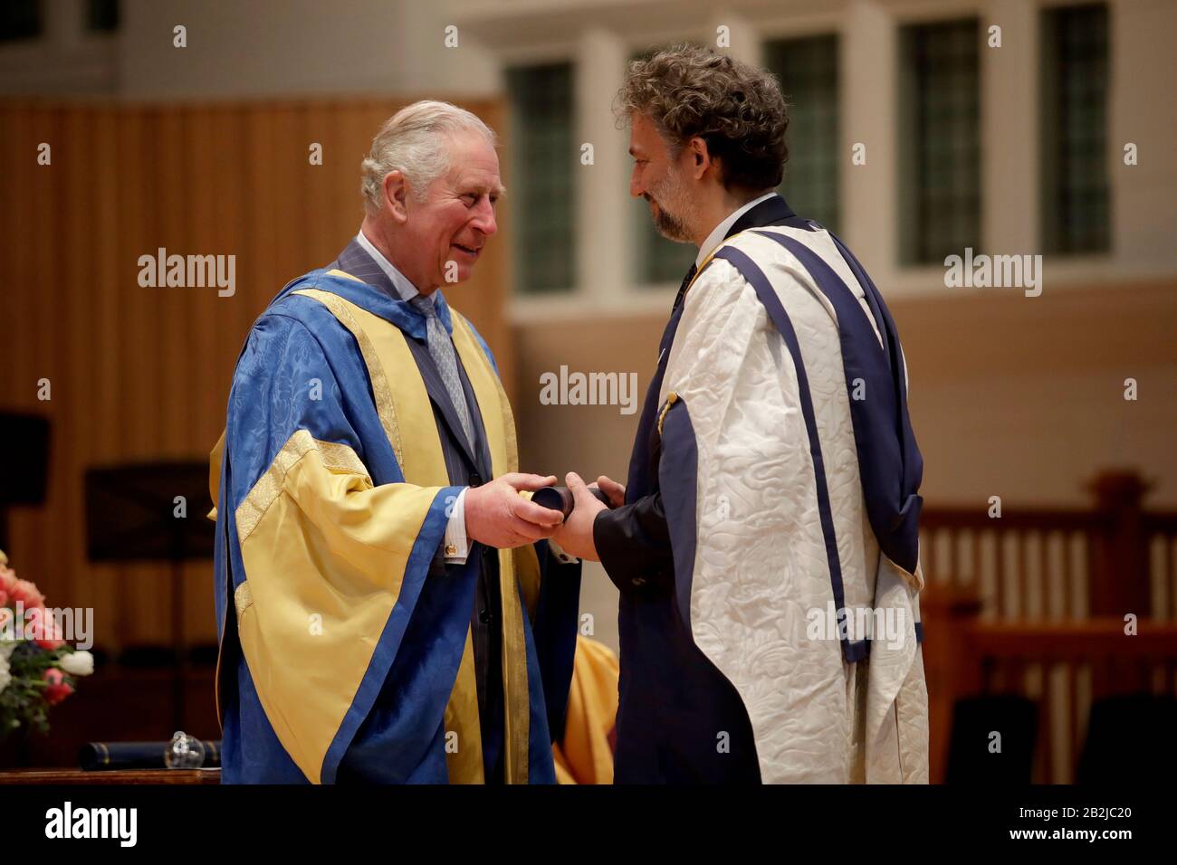 The Prince of Wales Charles presents German operatic tenor Jonas Kaufmann with an honorary Doctor of Music award at the Royal College of Music's annual awards in London. PA Photo. Picture date: Tuesday March 3, 2020. See PA story ROYAL Charles. Photo credit should read: Matt Dunham/PA Wire Stock Photo